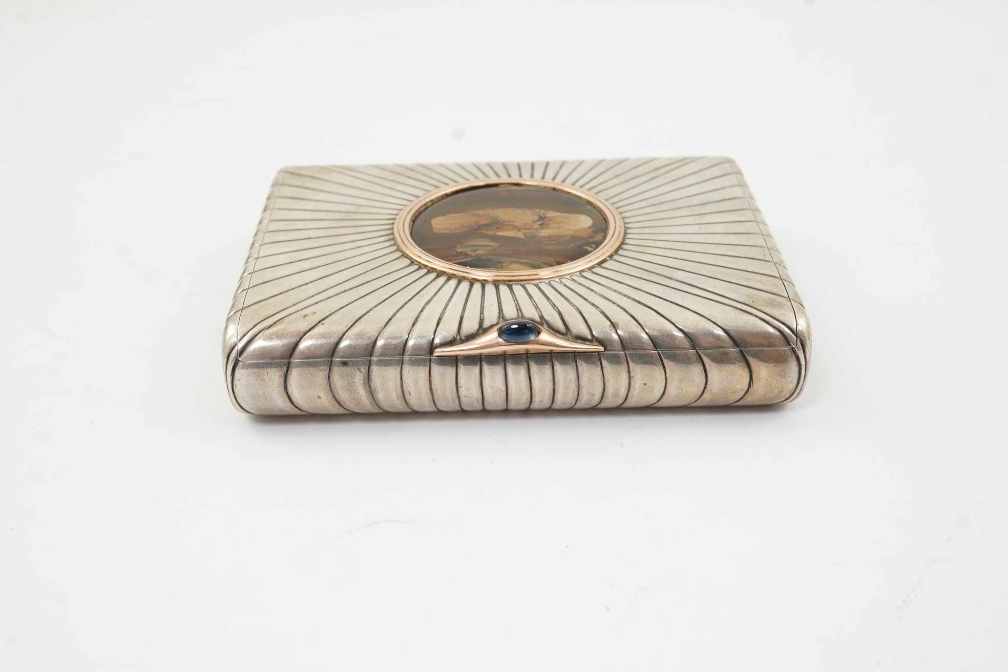 An early 20th century Russian 84 zolotnik silver cigarette case, with cappuccino agate inset cover, of ribbed rectangular form